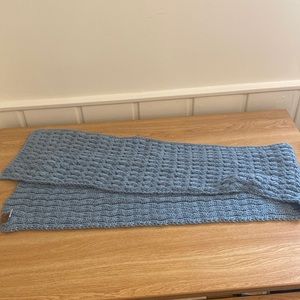 Blue knitted scarf